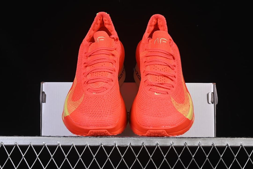 Front view of the pair of crimson running shoes