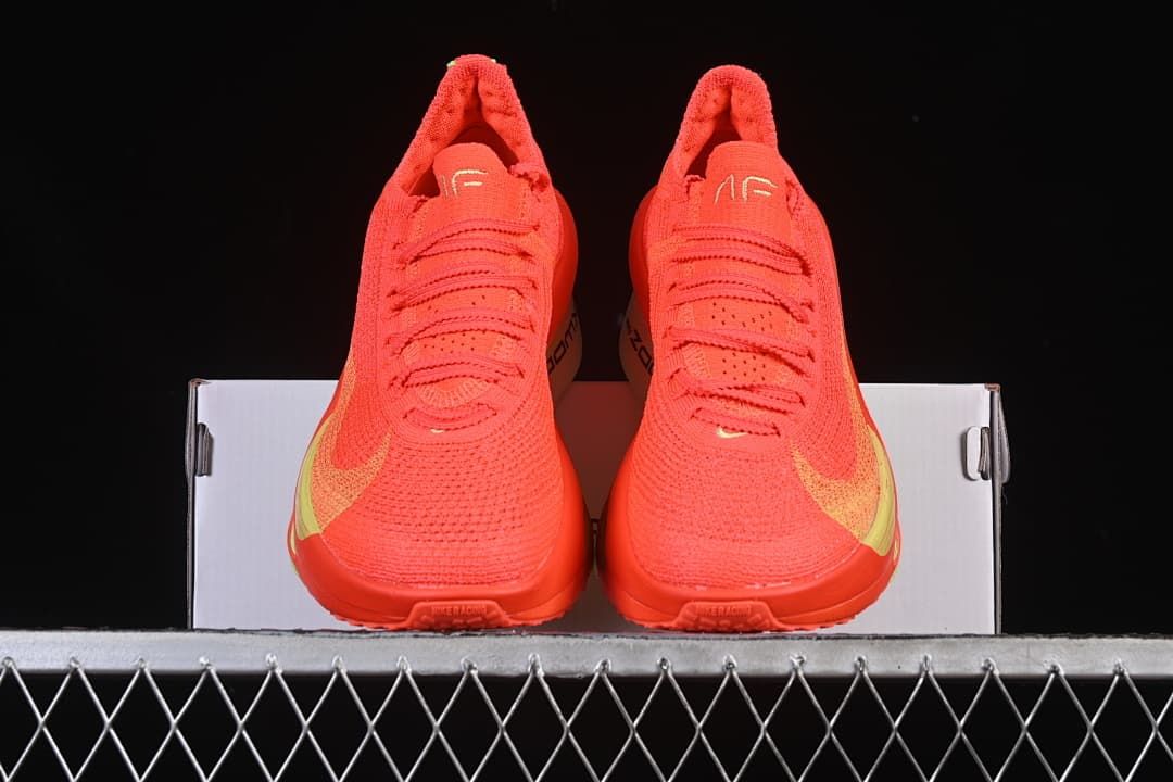 Front view of the pair of crimson running shoes
