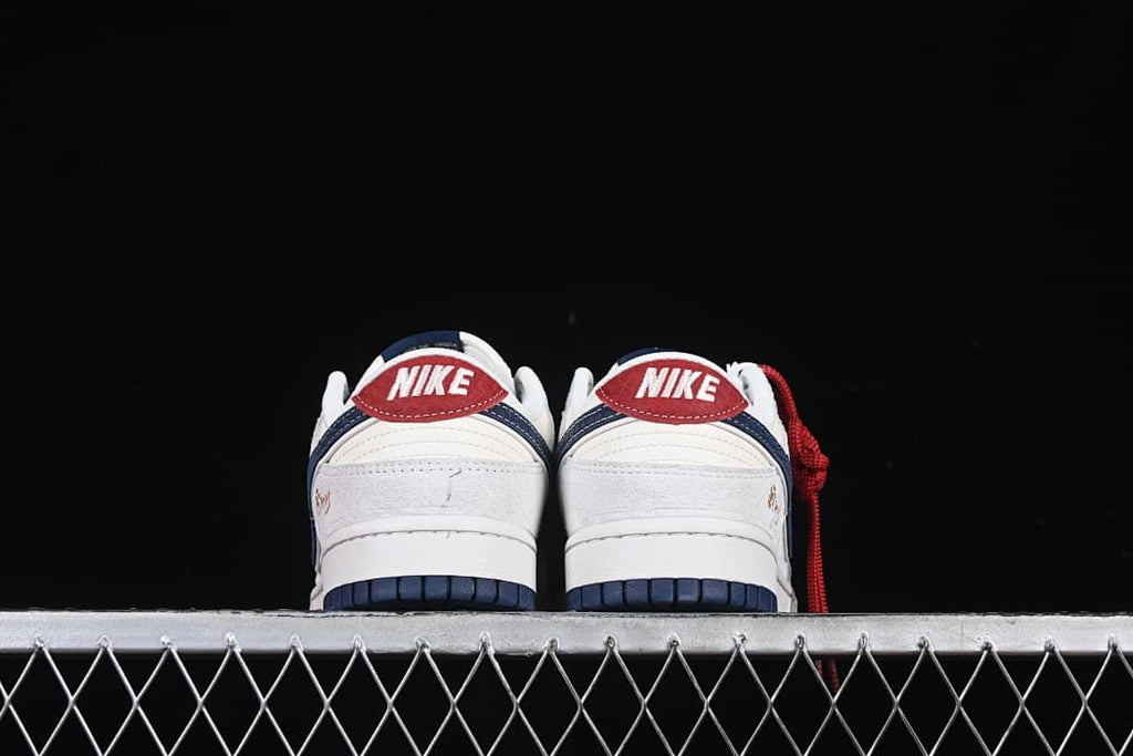Rear view of the pair showing red heel tabs and navy accents