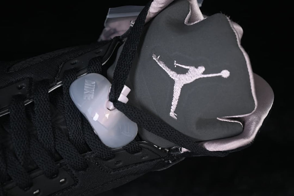 Close-up of the tongue, embroidered Jumpman logo, and lace toggle