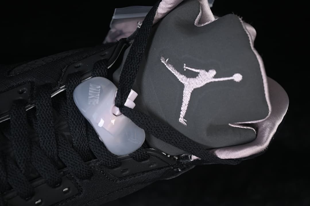 Close-up of the tongue, embroidered Jumpman logo, and lace toggle