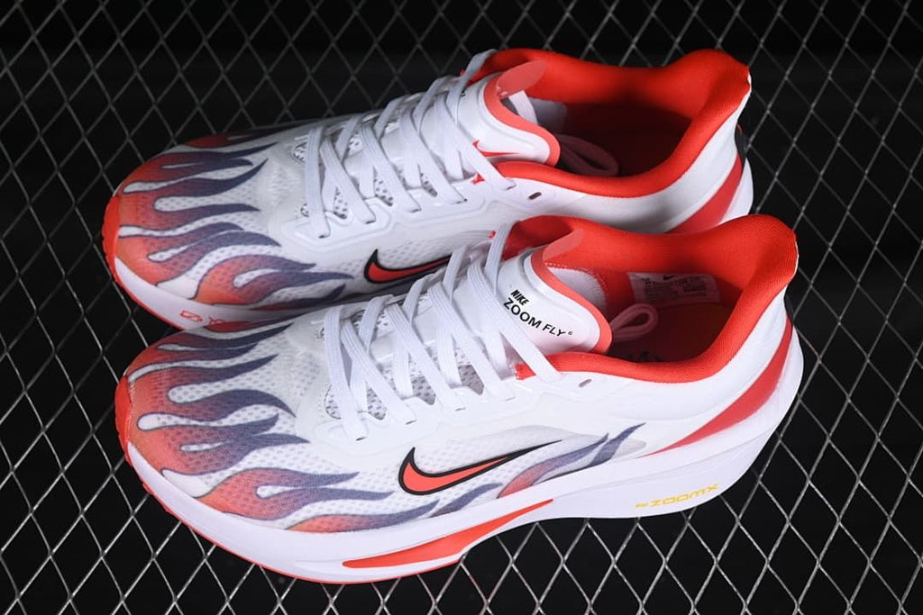 Pair of white and red Zoom Fly 6 running shoes viewed from above