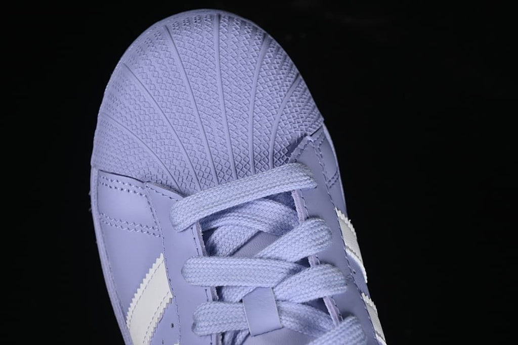 Top-down detail of the textured shell toe and lavender laces