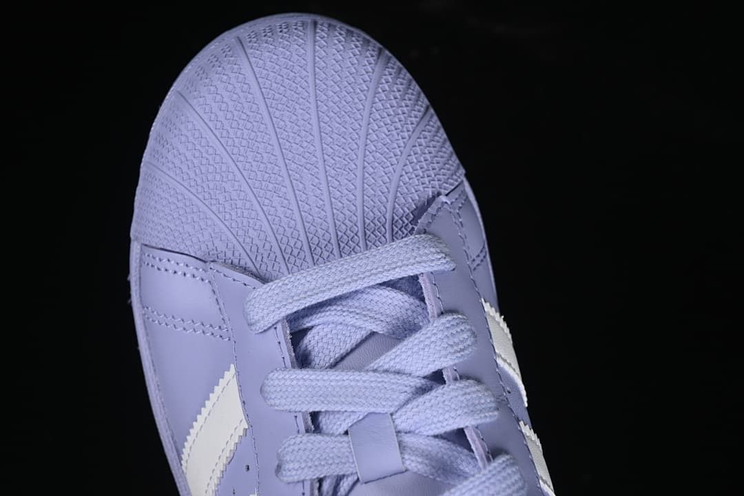 Top-down detail of the textured shell toe and lavender laces