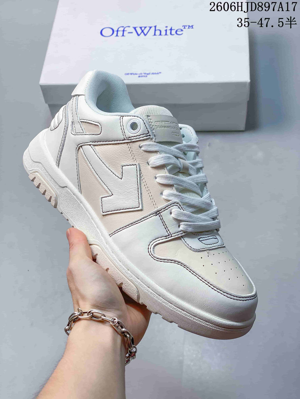 Angled side view of a white low-top sneaker with contrast stitching