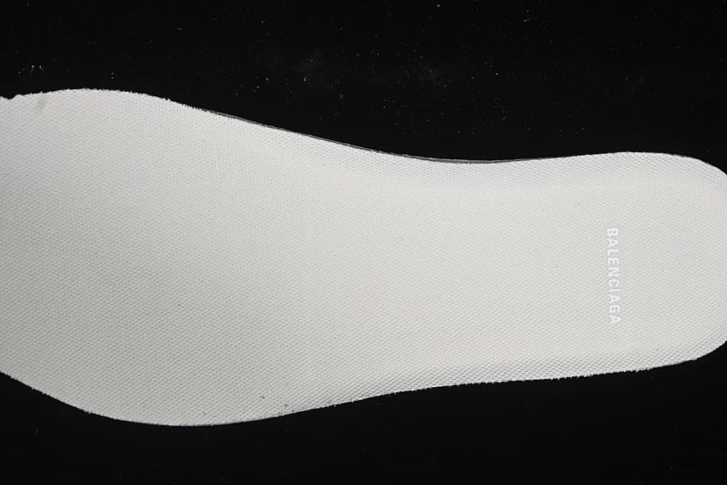 Light-colored insole with visible branding