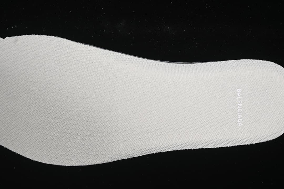 Light-colored insole with visible branding