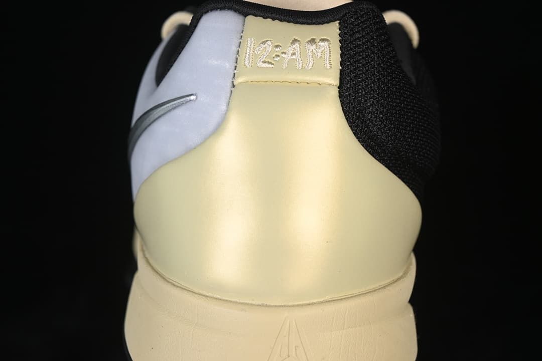 Rear view showing Ja 2 branding and pale yellow heel