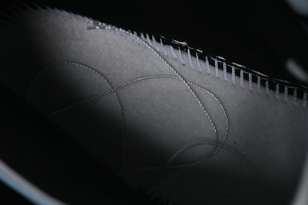 Close-up of stitched interior shoe panels