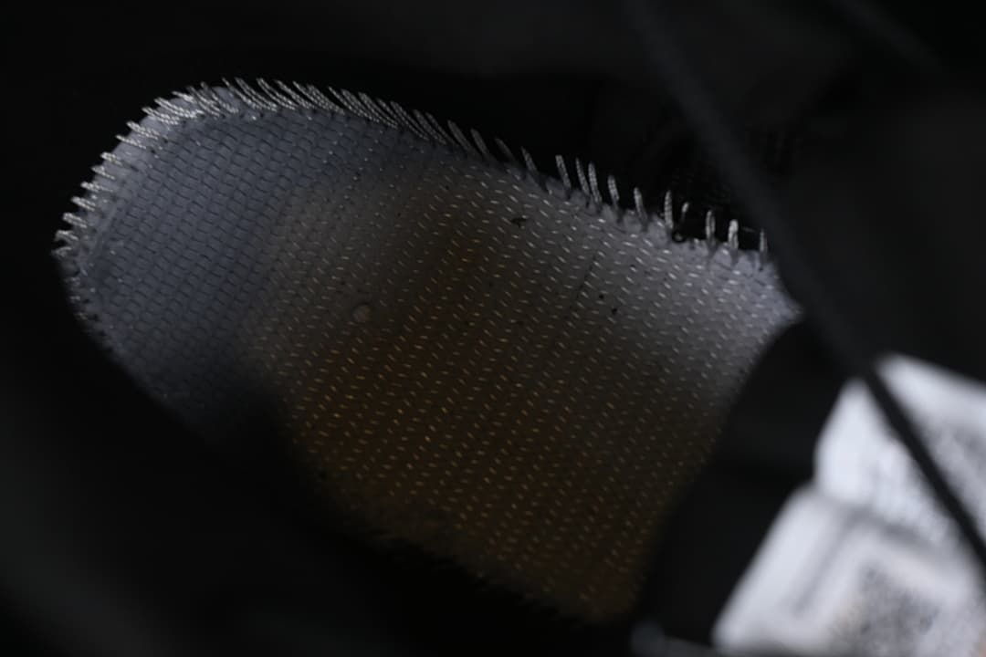 Close-up of the sneaker's black textured upper