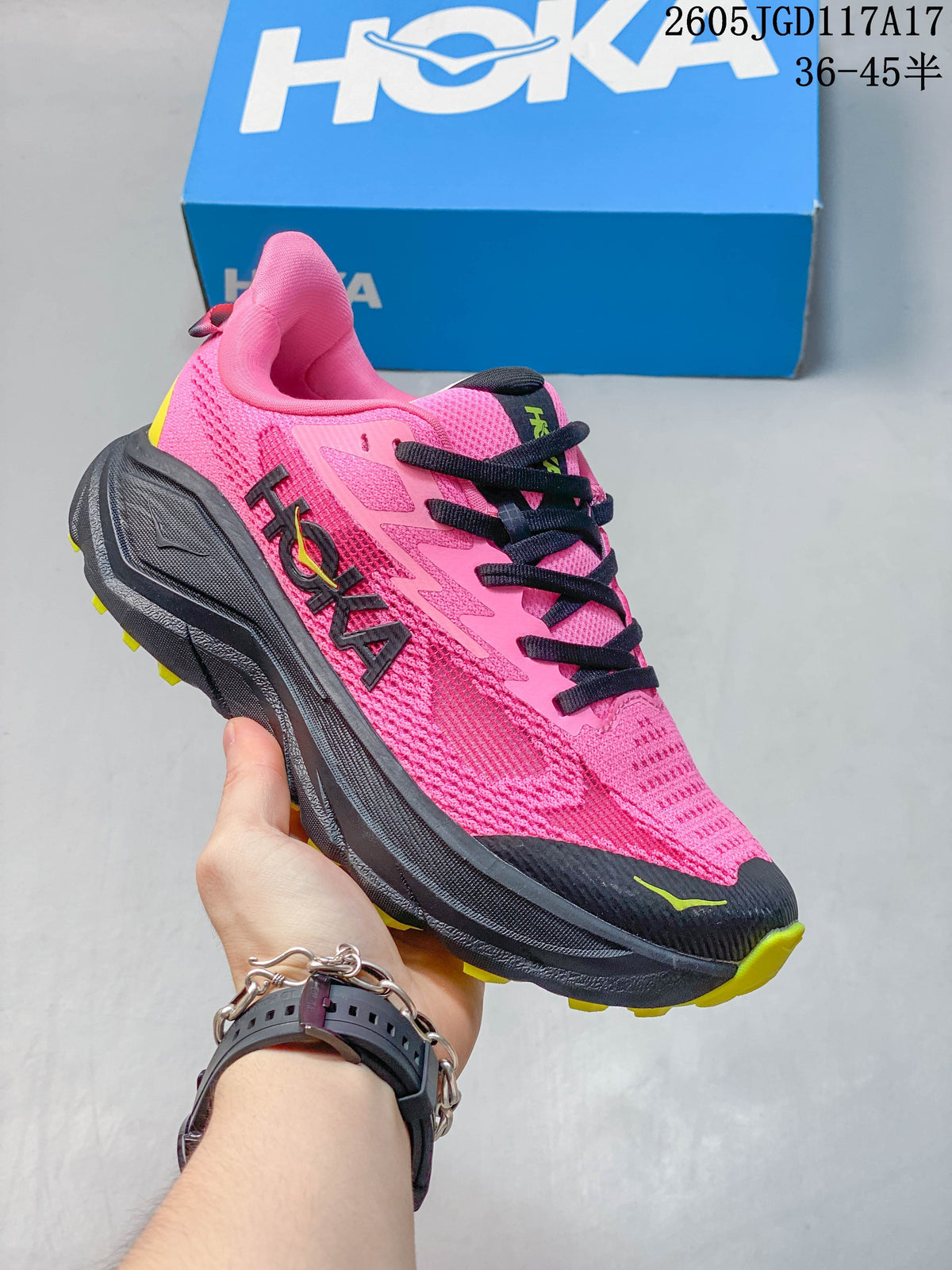 Bright pink Hoka Mafate Speed 2 shoe with black accents and a dark lugged outsole.