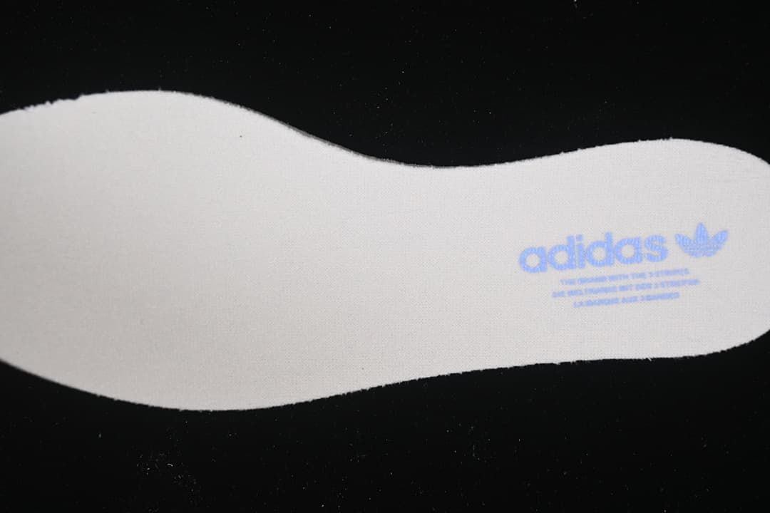Close-up of the insole showing an adidas Trefoil mark.