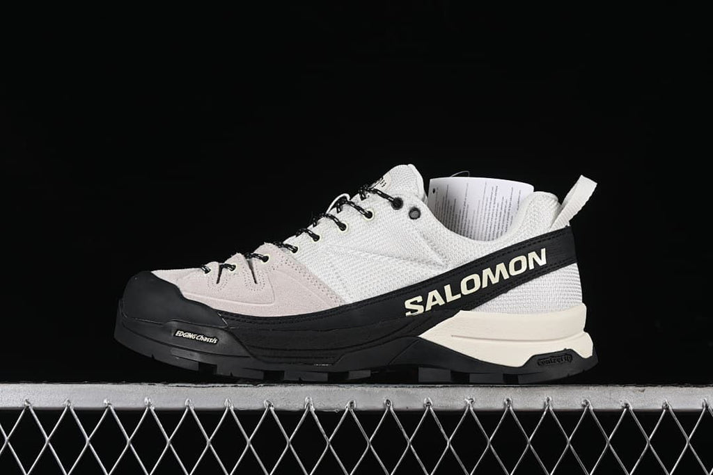 Side view of a Salomon X-ALP MM6 trail sneaker in vanilla, black, and almond milk