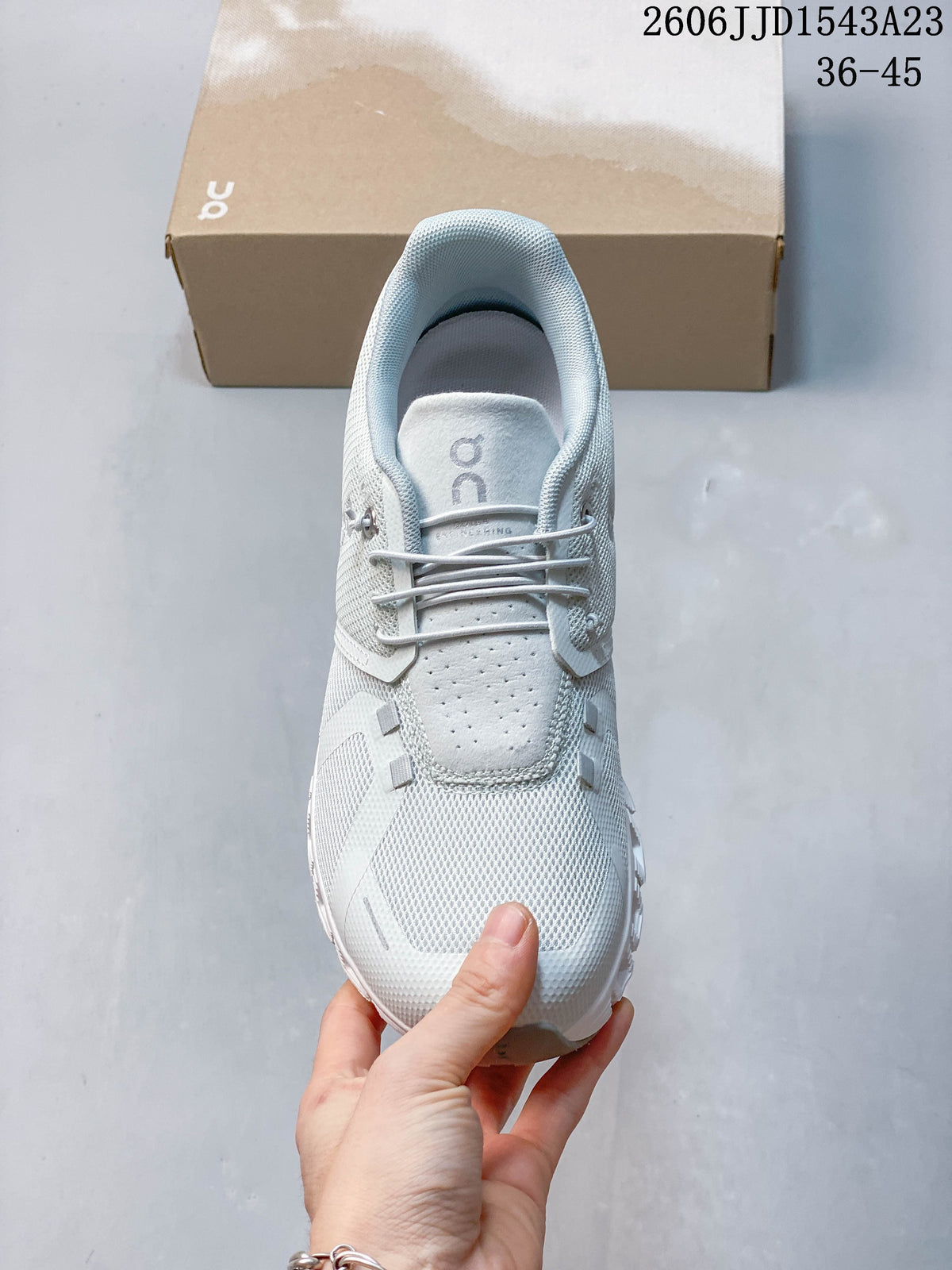 Top view of a light-colored On Cloudtilt Remix sneaker
