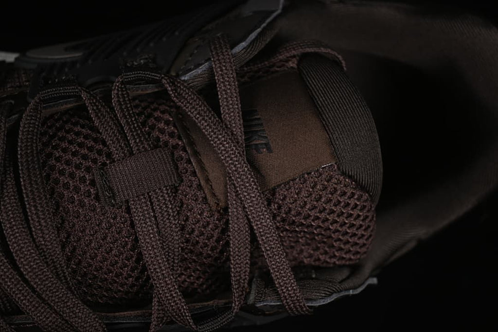 Close-up of the mesh-look tongue and brown laces