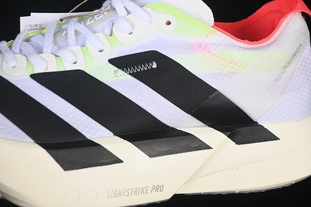 Close-up of the side stripes, shoe upper, and midsole marked Lightstrike Pro.