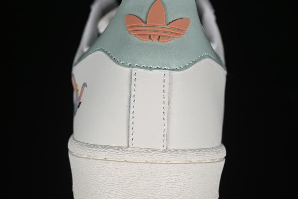 Rear detail with pale aqua heel panel and coral adidas trefoil