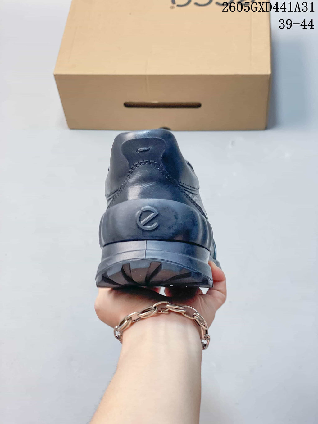 Rear view of the dark navy sneaker and heel