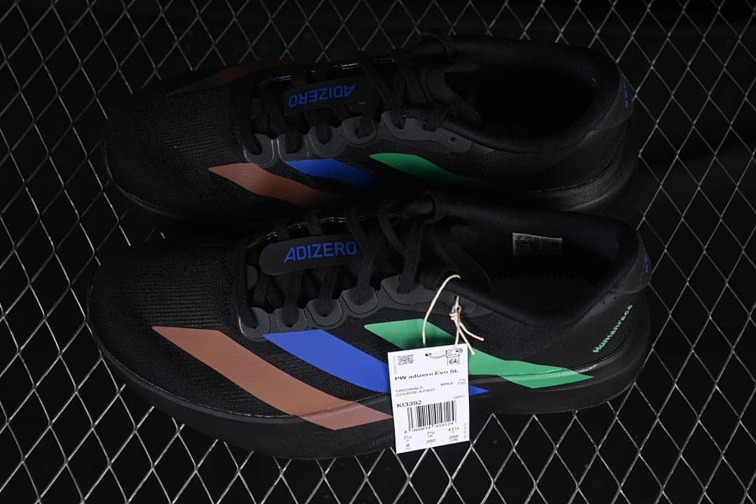 Pair of black Adizero Evo SL shoes with a product hangtag.