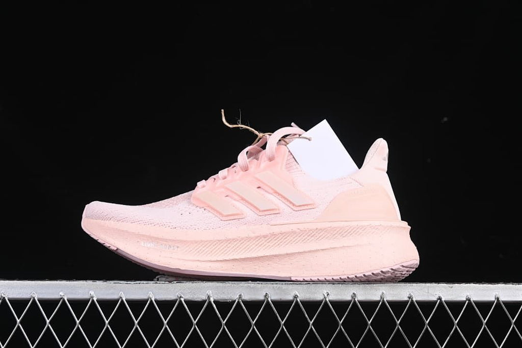Side view of pink adidas Ultraboost 5 W running shoe