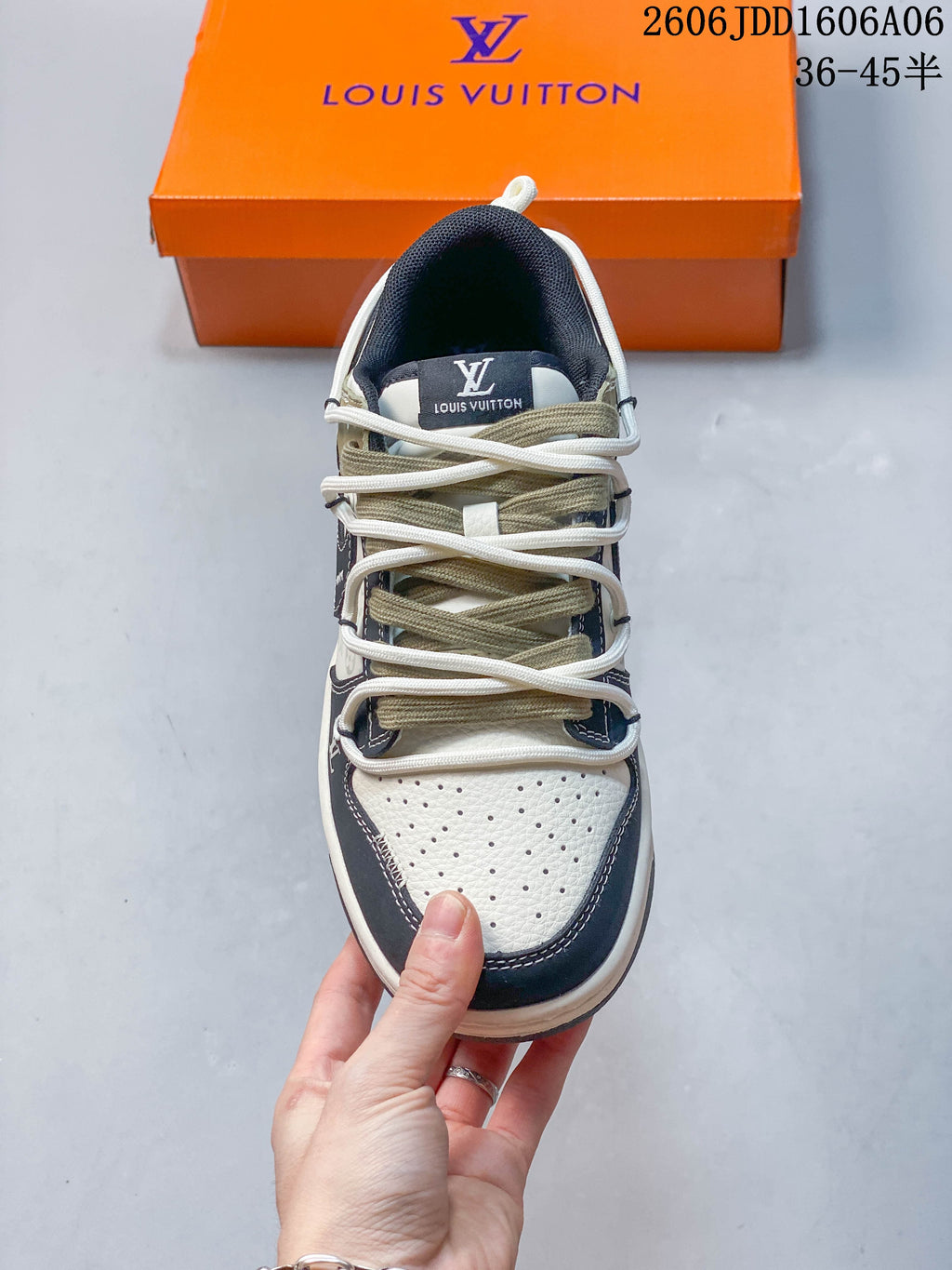Top-down view of the perforated toe and layered lacing on a Nike SB Dunk Low sneaker