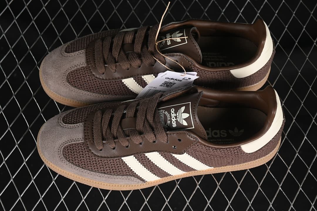 Pair of brown Samba OG sneakers with off-white stripes