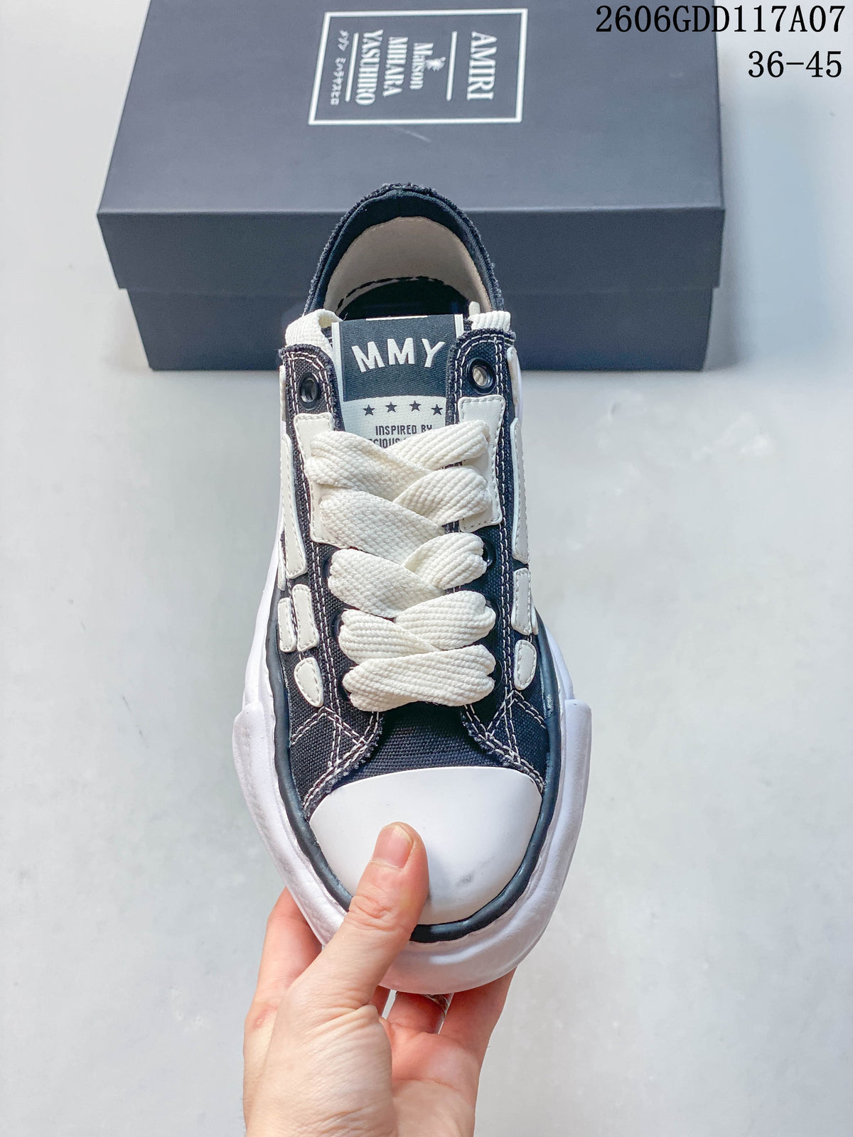 Front view showing the sneaker's laces, toe cap, and tongue