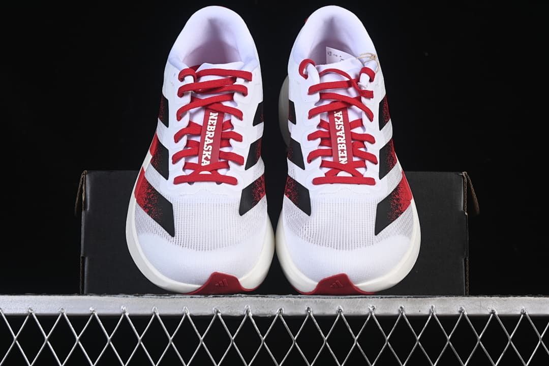 Front view of the pair showing red laces and contrasting side stripes