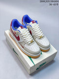 Pair of white and light gray Air Force 1-style sneakers with red and blue accents and gum-colored soles