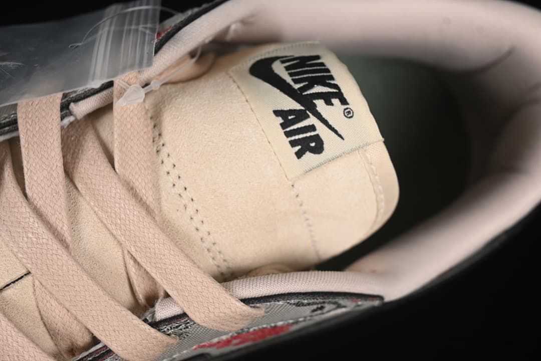 Close-up of the tongue label and pale pink laces