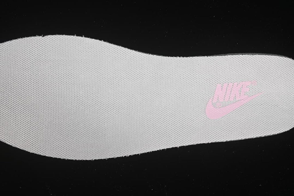 Close-up of the textured insole with a pink Nike logo