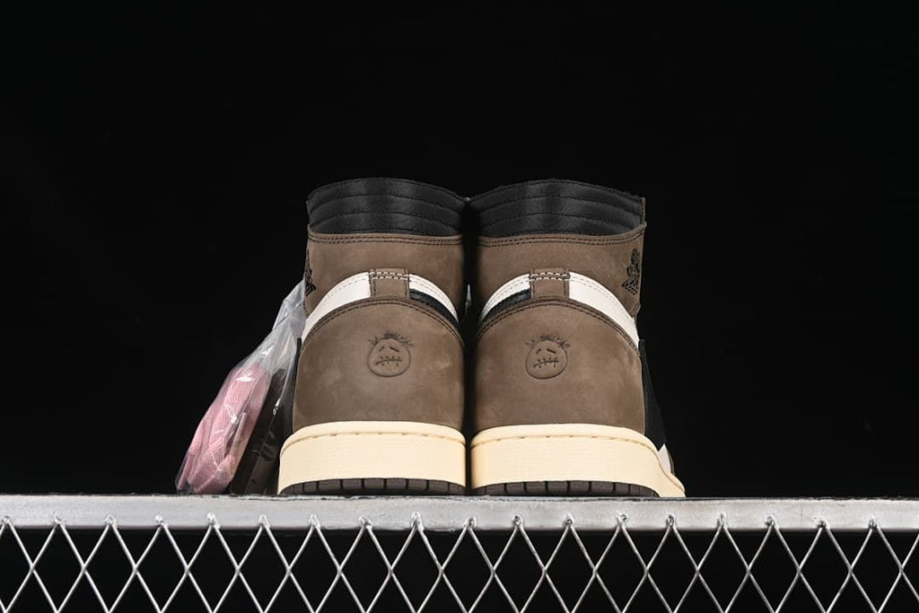 Rear view showing the brown heel panels and circular motifs