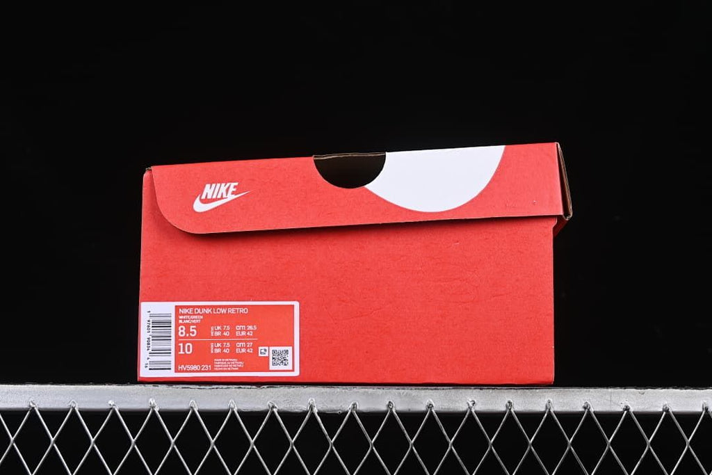 Red shoe box with a visible Nike Dunk Low Retro label and sample size information.