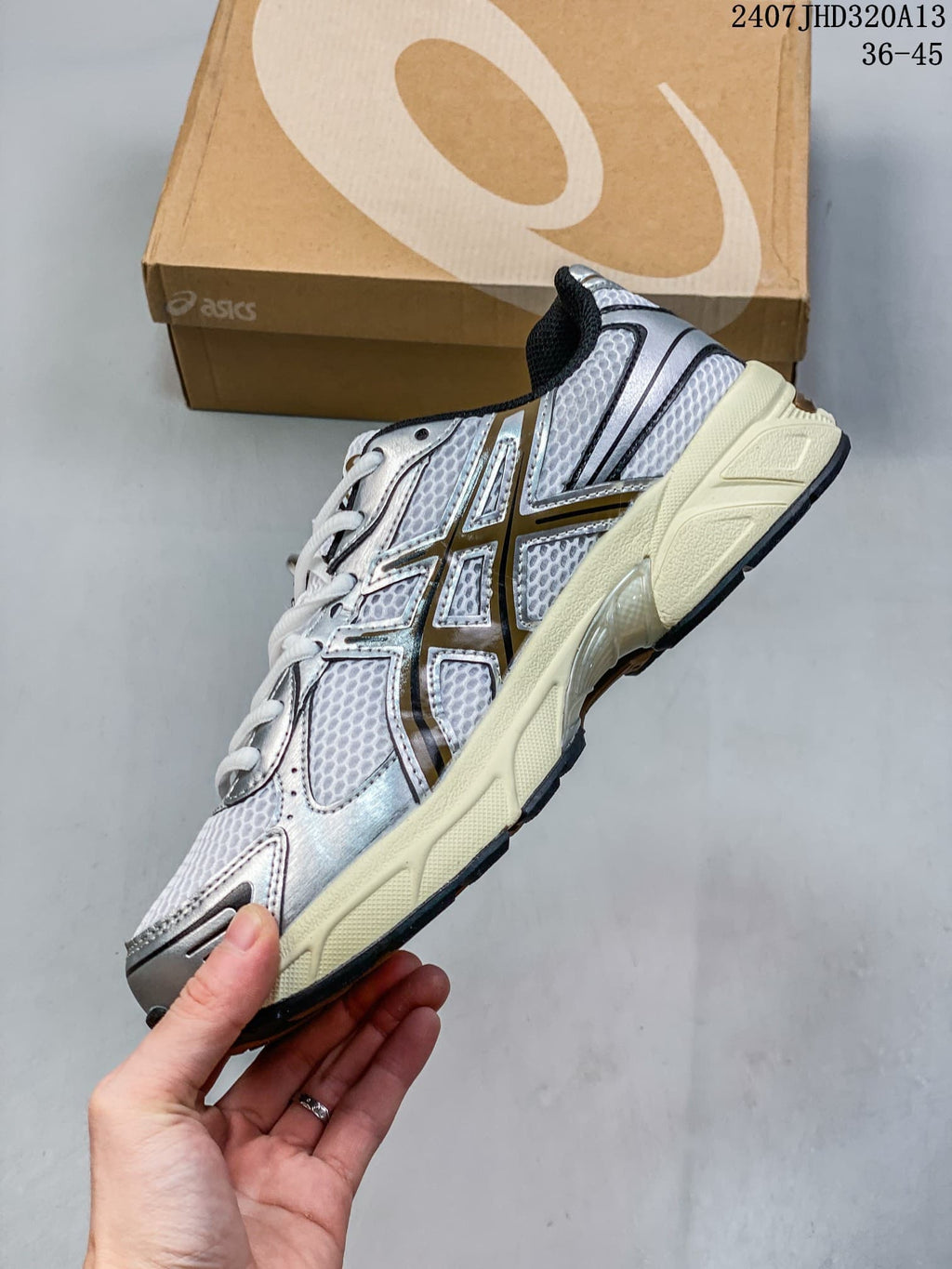Side view of the silver and white ASICS GEL-1130 sneaker