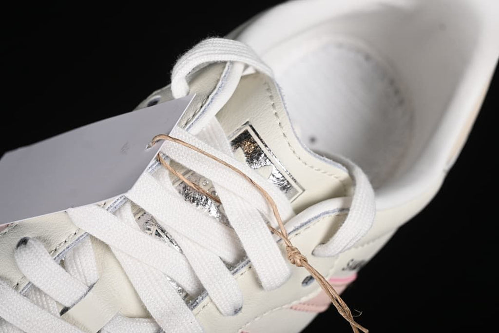 Close-up of white laces, tongue, and tongue detail