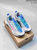 Nike Wildhorse 10 shoes in white, blue, and pink with turquoise laces, shown on a trail shoe box.