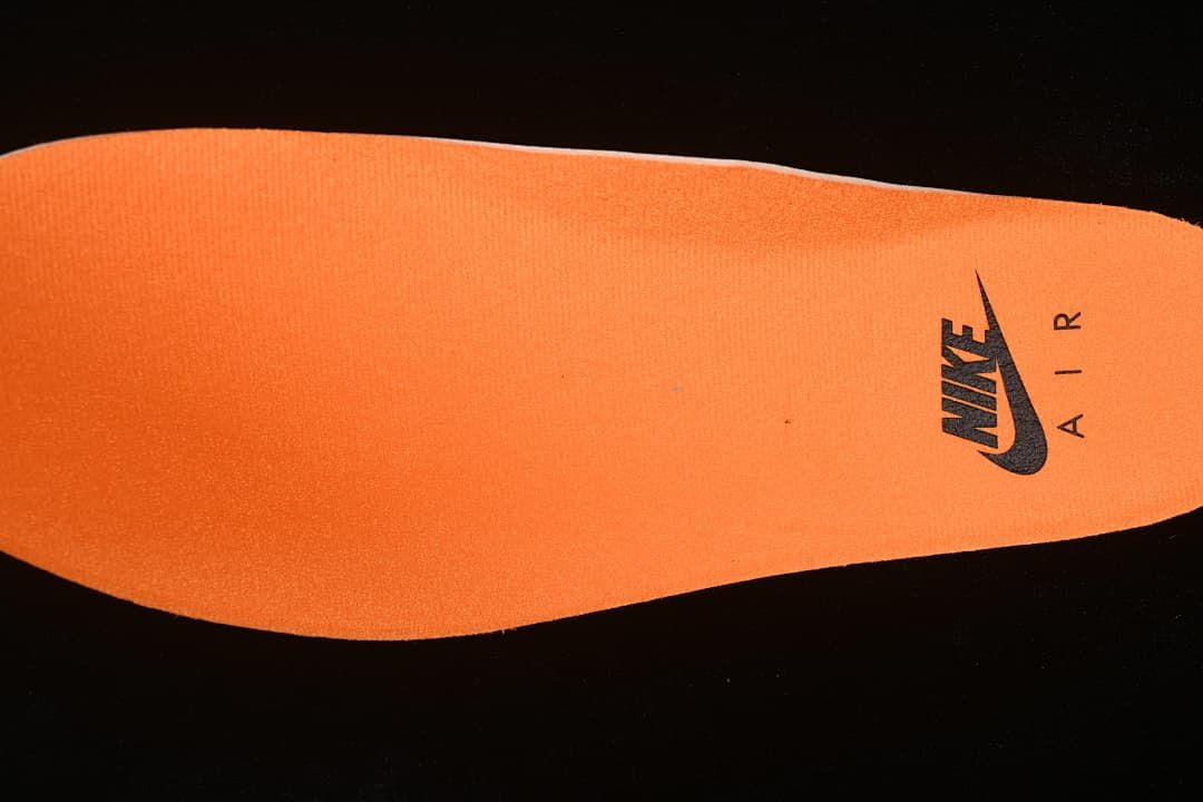 Orange shoe insert with a Nike Air mark
