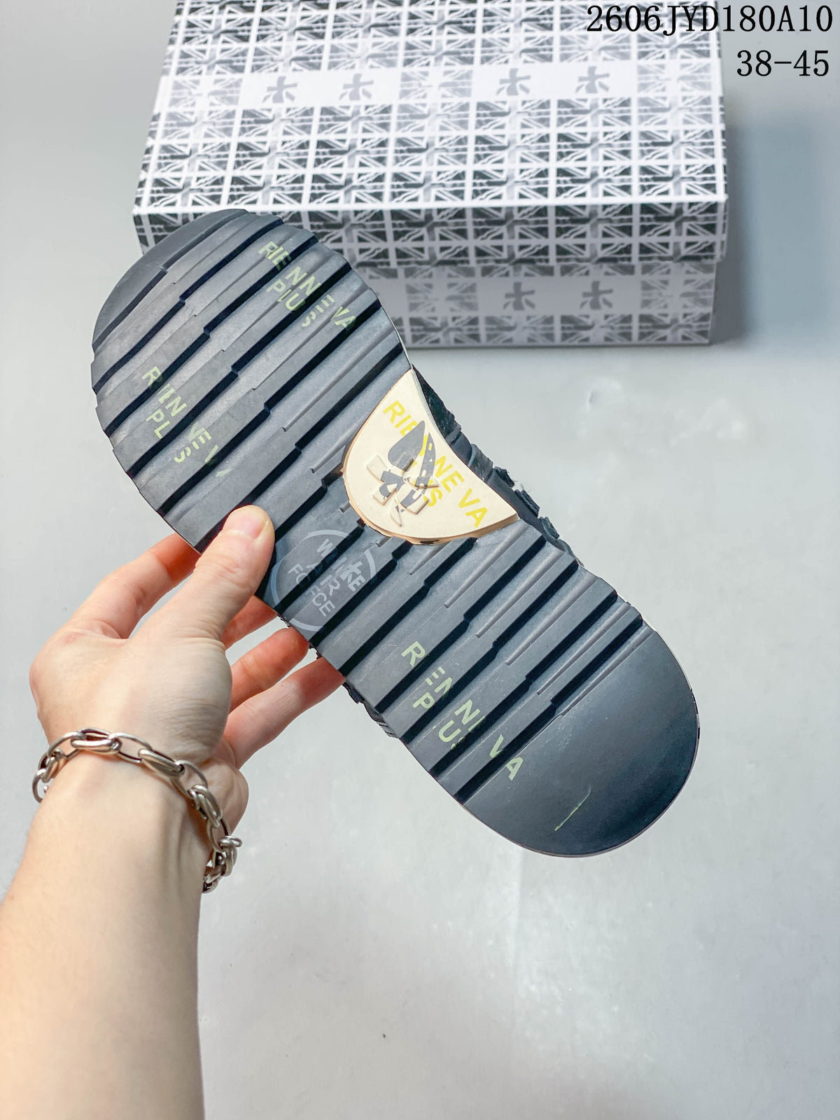 Close-up of the trainer outsole with deep horizontal grooves