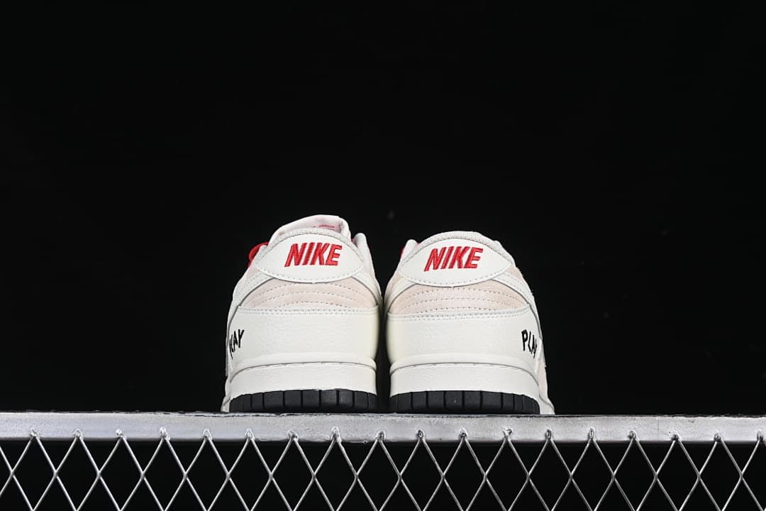 Rear view of both sneakers with red heel branding