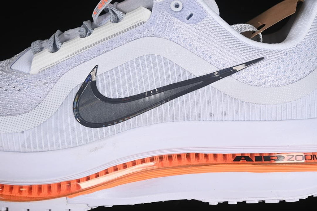 Close-up of the side Swoosh and orange cushioning detail