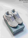 Pair of grey New Balance 2010 sneakers displayed on a shoebox