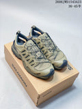 Pair of olive-toned Salomon XA Pro 3D Amphib shoes displayed on a Salomon box