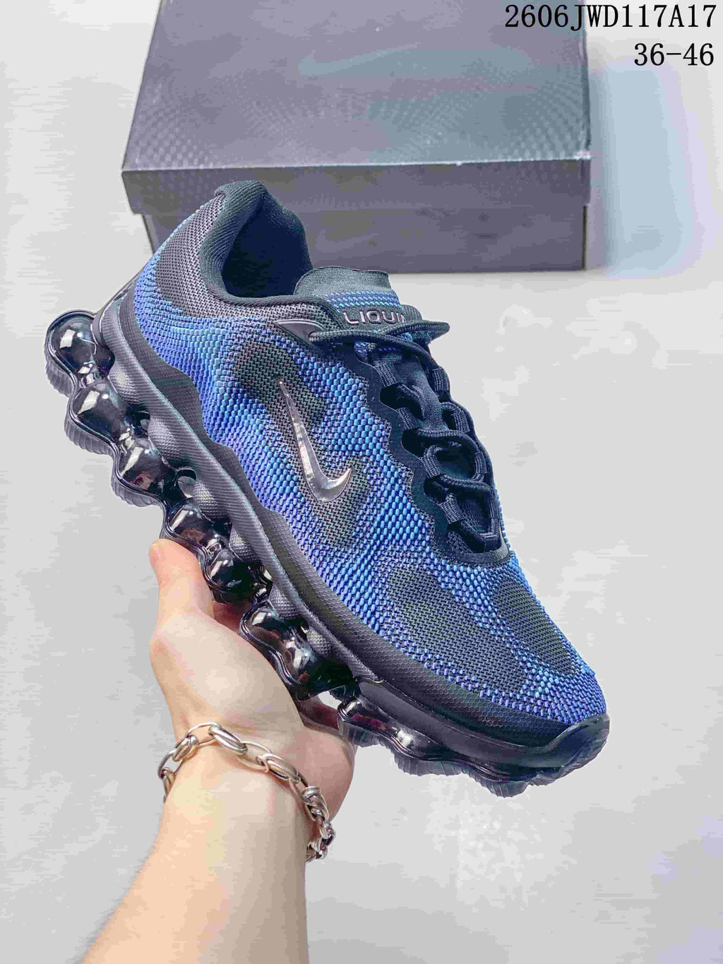 Dark gray and purple-blue Nike Air Liquid Max sneaker shown from the side