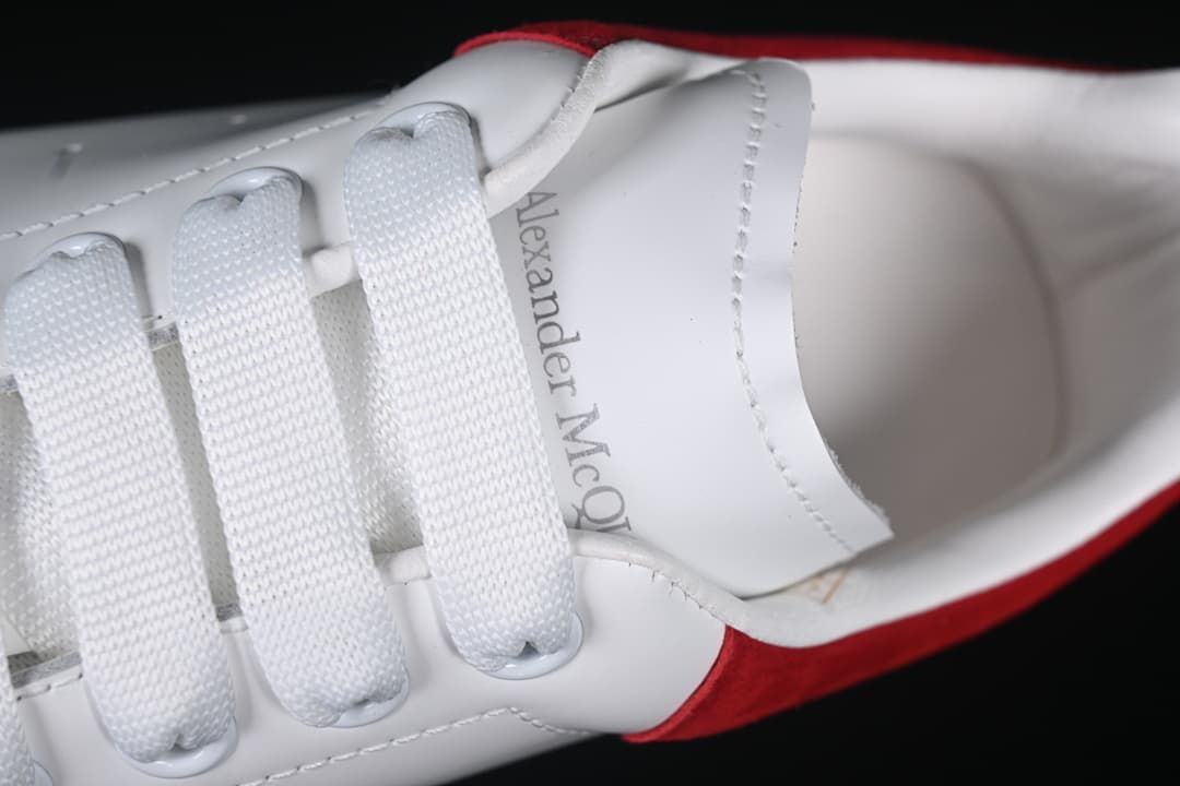 Close-up of the white laces and tongue with visible branding.