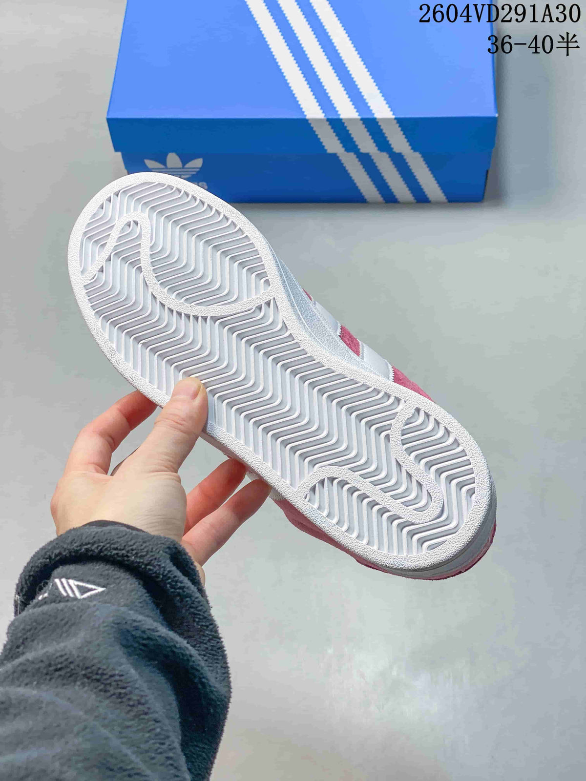 Underside of the sneaker showing a white patterned outsole.