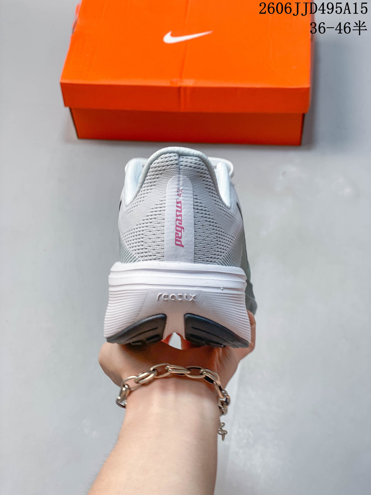 Rear view of a white and gray-green Nike Pegasus 42 running shoe