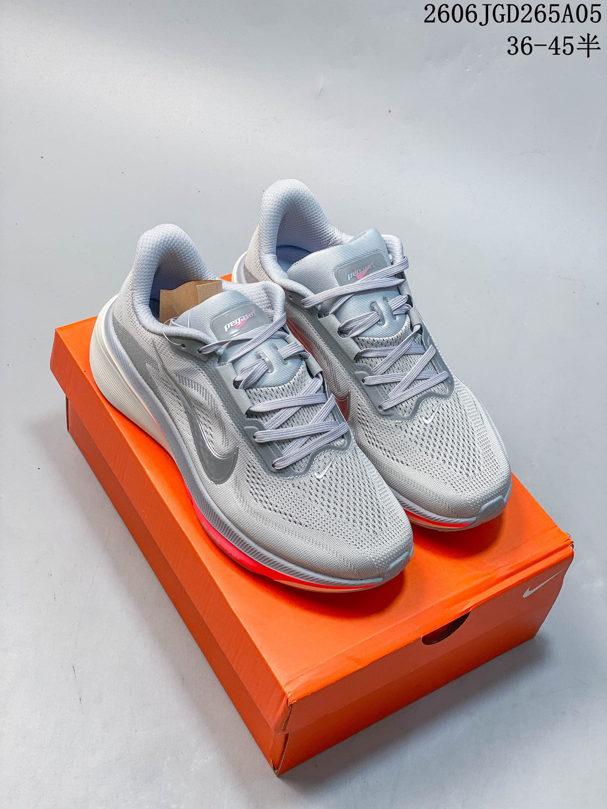 Three Nike Pegasus 42 shoes shown from the side in white with dark, green, and coral accents.