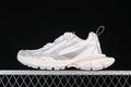 Side view of beige and silver Balenciaga 3XL sneakers against a black background
