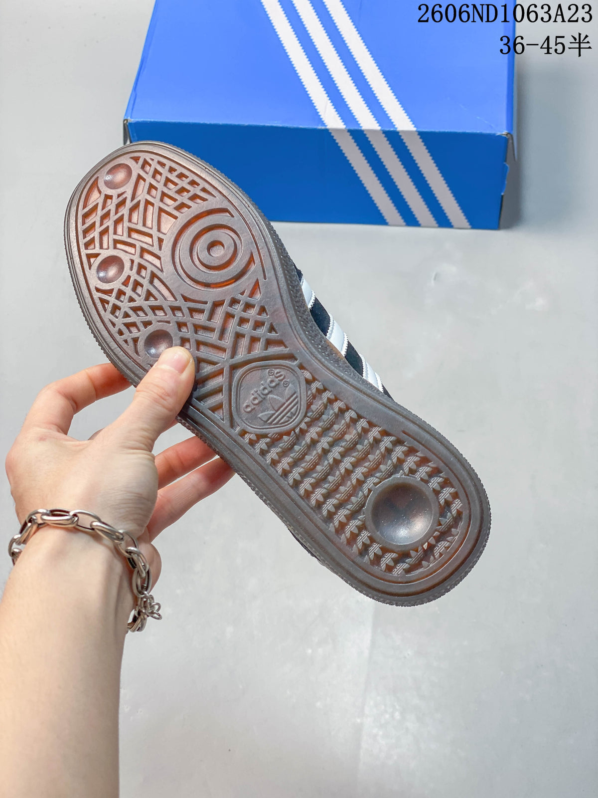 Underside view showing the patterned gum-colored outsole