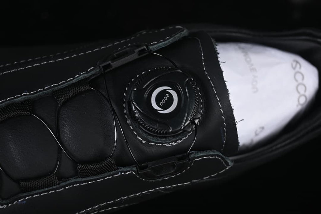 Close-up of the dial-adjustment closure on the shoe tongue